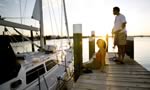 Couple winding down at Marsh Harbour after a day of sailing the Sea of Abaco, The Out Islands of The Bahamas